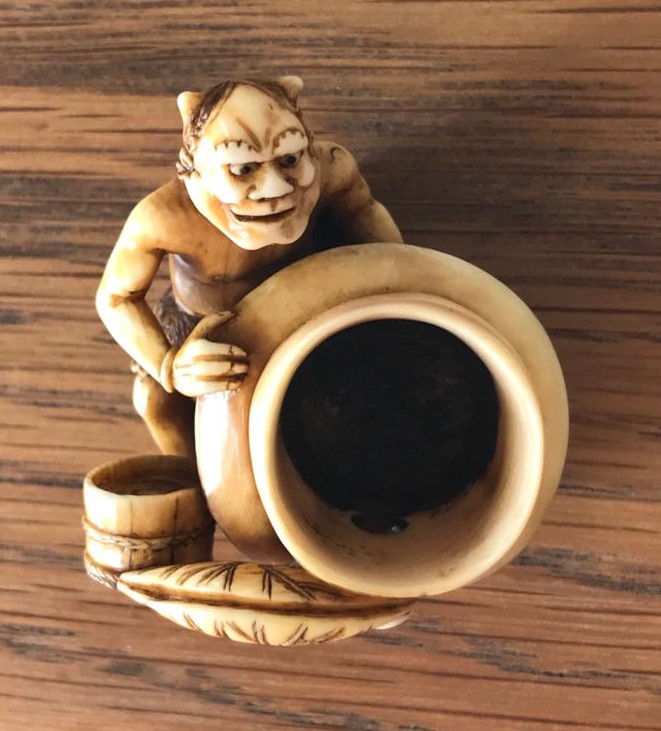 Netsuke oni polishing temple bell 1.jpg